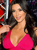 Kim Kardashian poses with her new wax figure