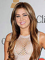 Miley Cyrus shows deep cleavage at Pre GRAMMY