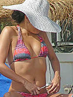 Eva Longoria inspecting her pussy on a beach