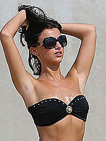 Lucy Mecklenburgh in black bikini on a beach