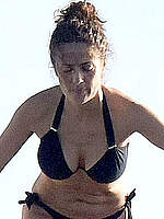 Salma Hayek sexy in black bikini on a beach