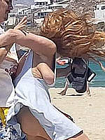 Lindsay Lohan sideboob fighting at a beach
