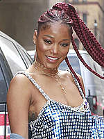 Keke Palmer wears a metallic dress at a show