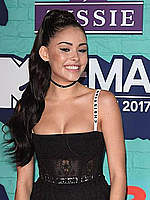 Madison Beer shows cleavage in black dress