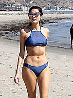 Blanca Blanco in in blue bikini on a beach