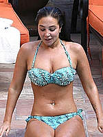 Tulisa Contostavlos wearing a bikini at a pool