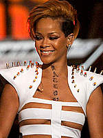 Rihanna sexy performs in white bondage outfit