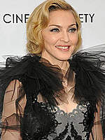 Madonna posing for paparazzi at premiere