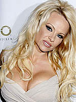 Pamela Anderson shows cleavage paparazzi pix