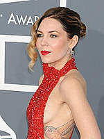 Skylar Grey shows side of boob in red dress